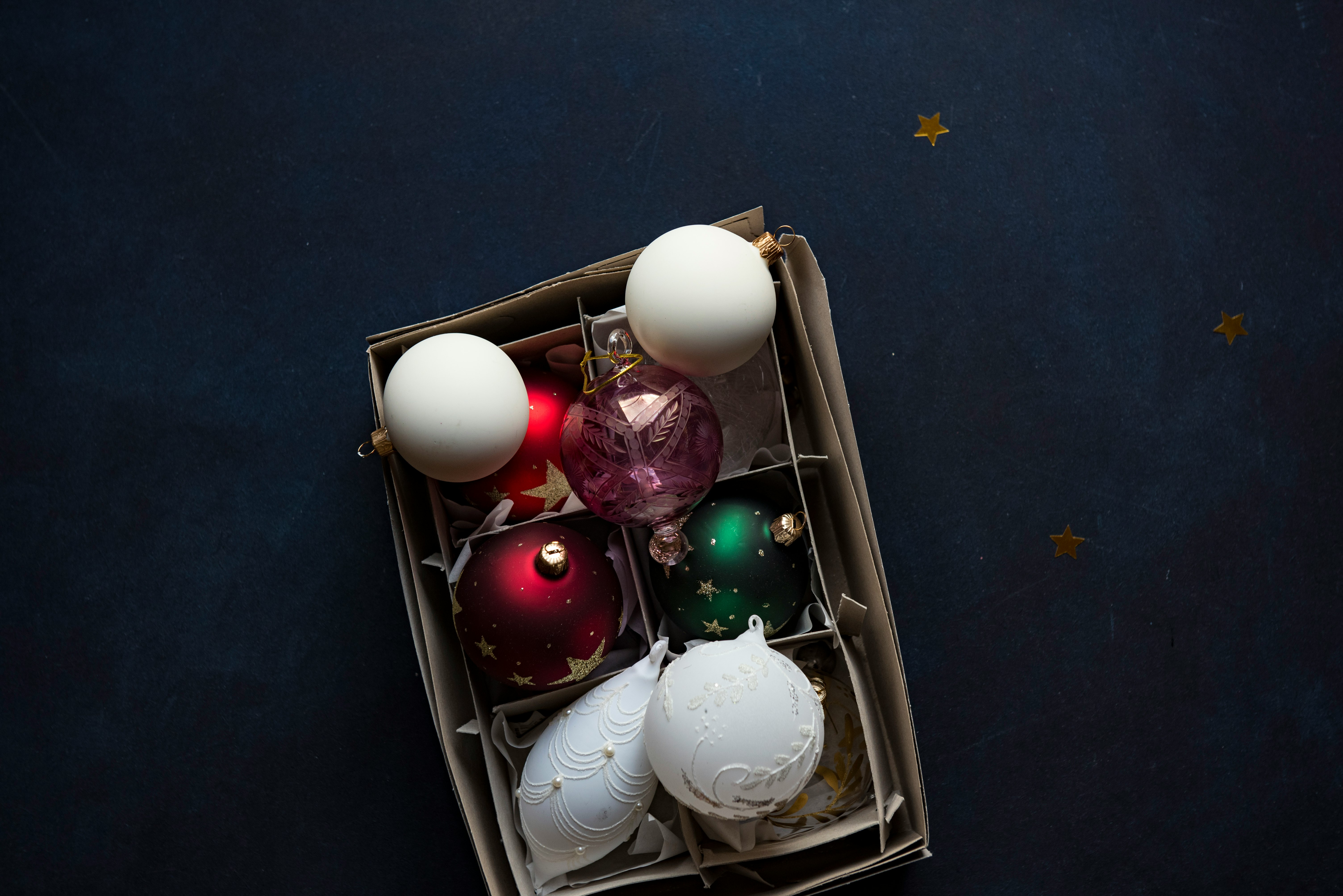 shallow focus photography of six assorted-color baubles